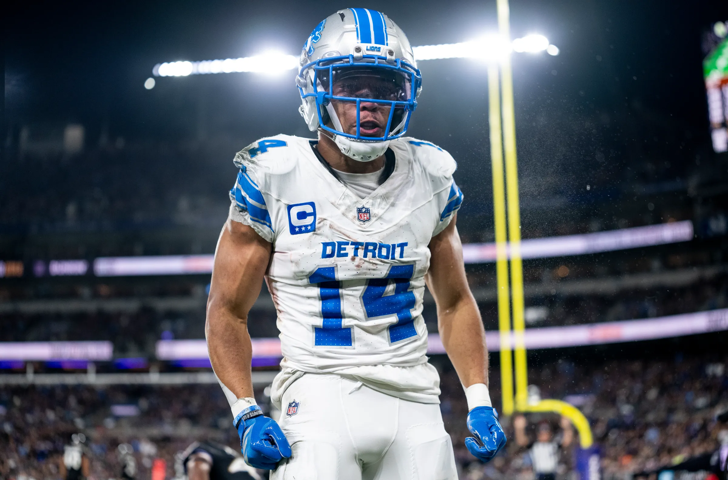 man wearing silver football helmet and white jersey
